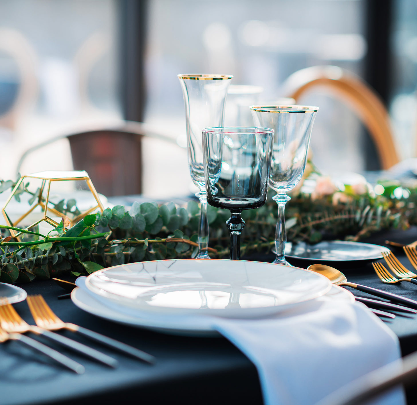 Black and gold color Elegant table set for Wedding celebration reception in barn or luxury dinner party